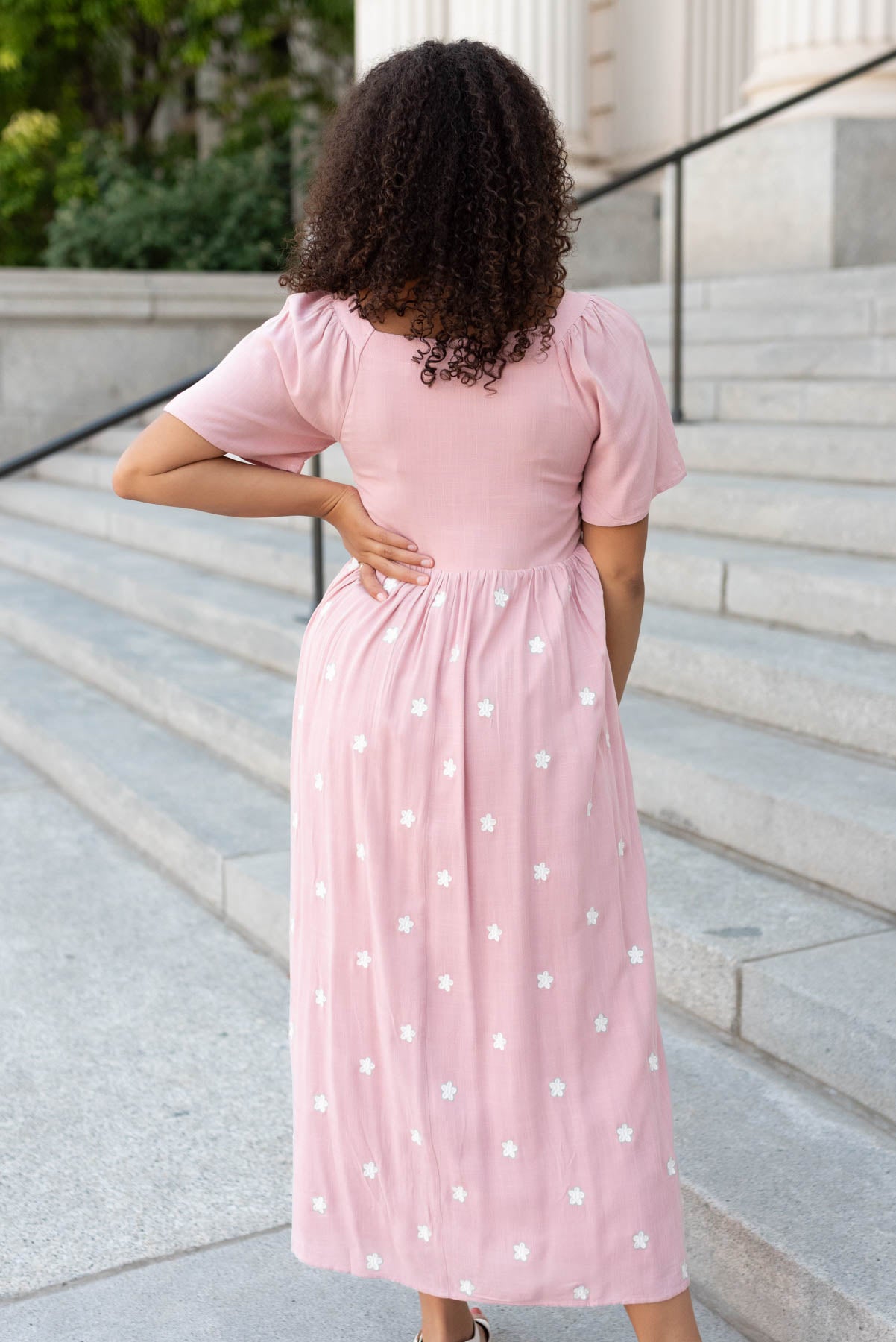 Back view of the blush embroidered dress