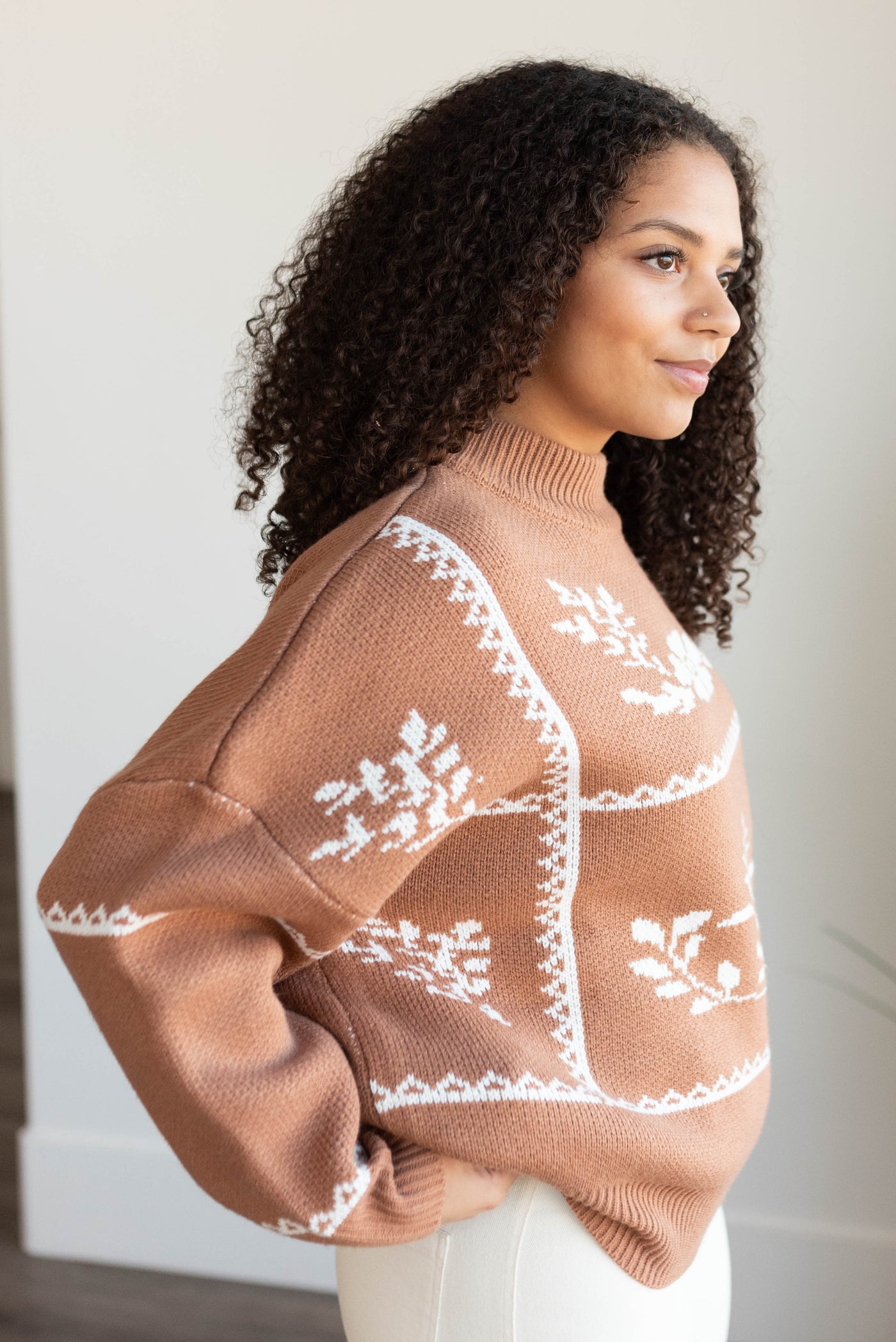 Side view of the mocha floral printed sweater