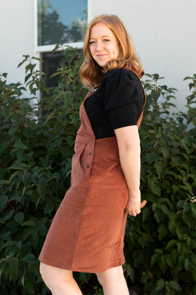 Side view of a cinnamon dress