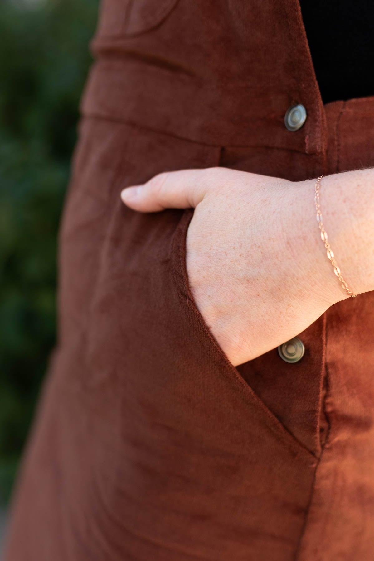 Pocket view of a overall cinnamon dress