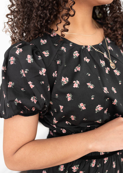 Close up of the fabric and sleeves on the black floral dress