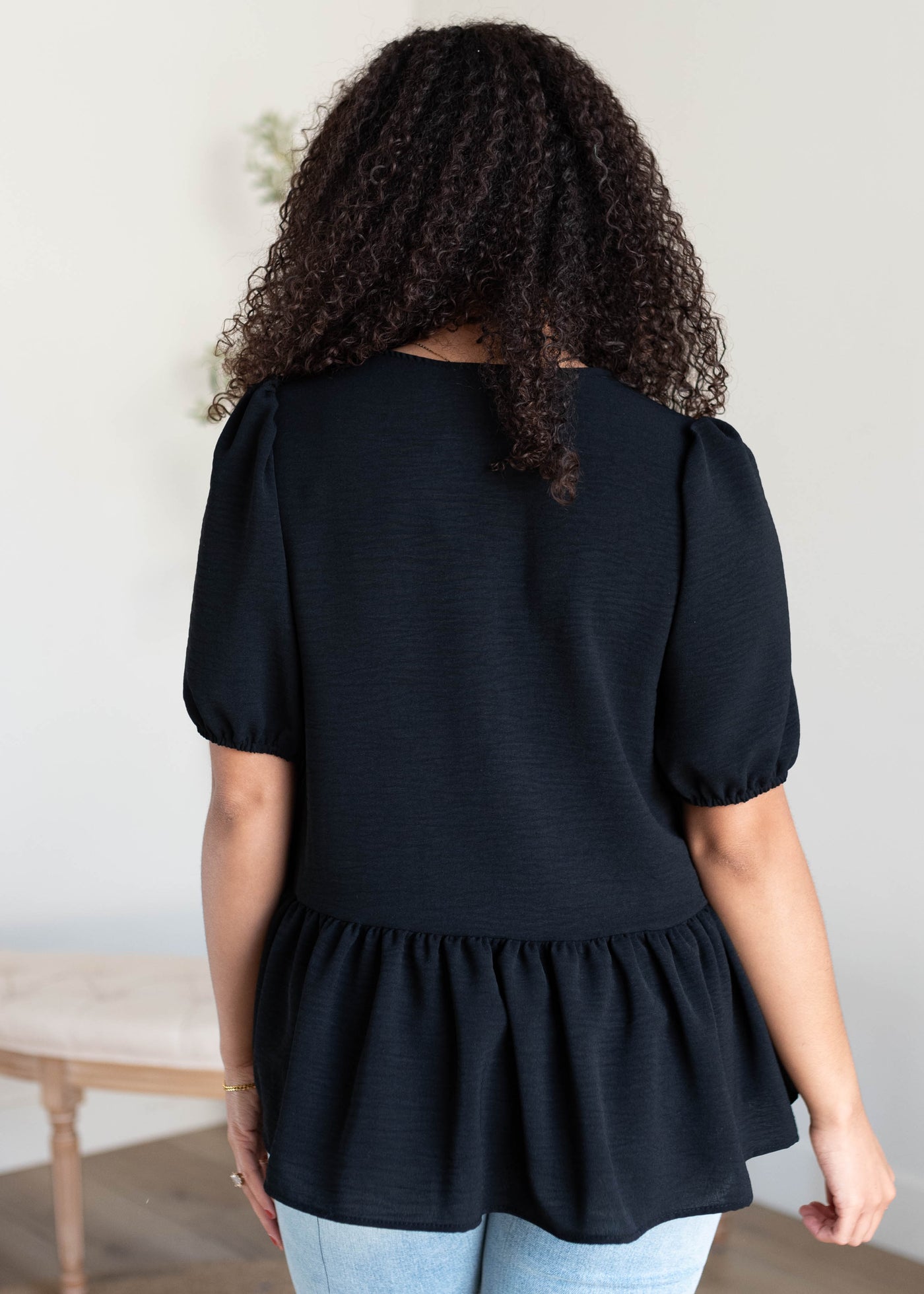 Back view of the black tiered blouse