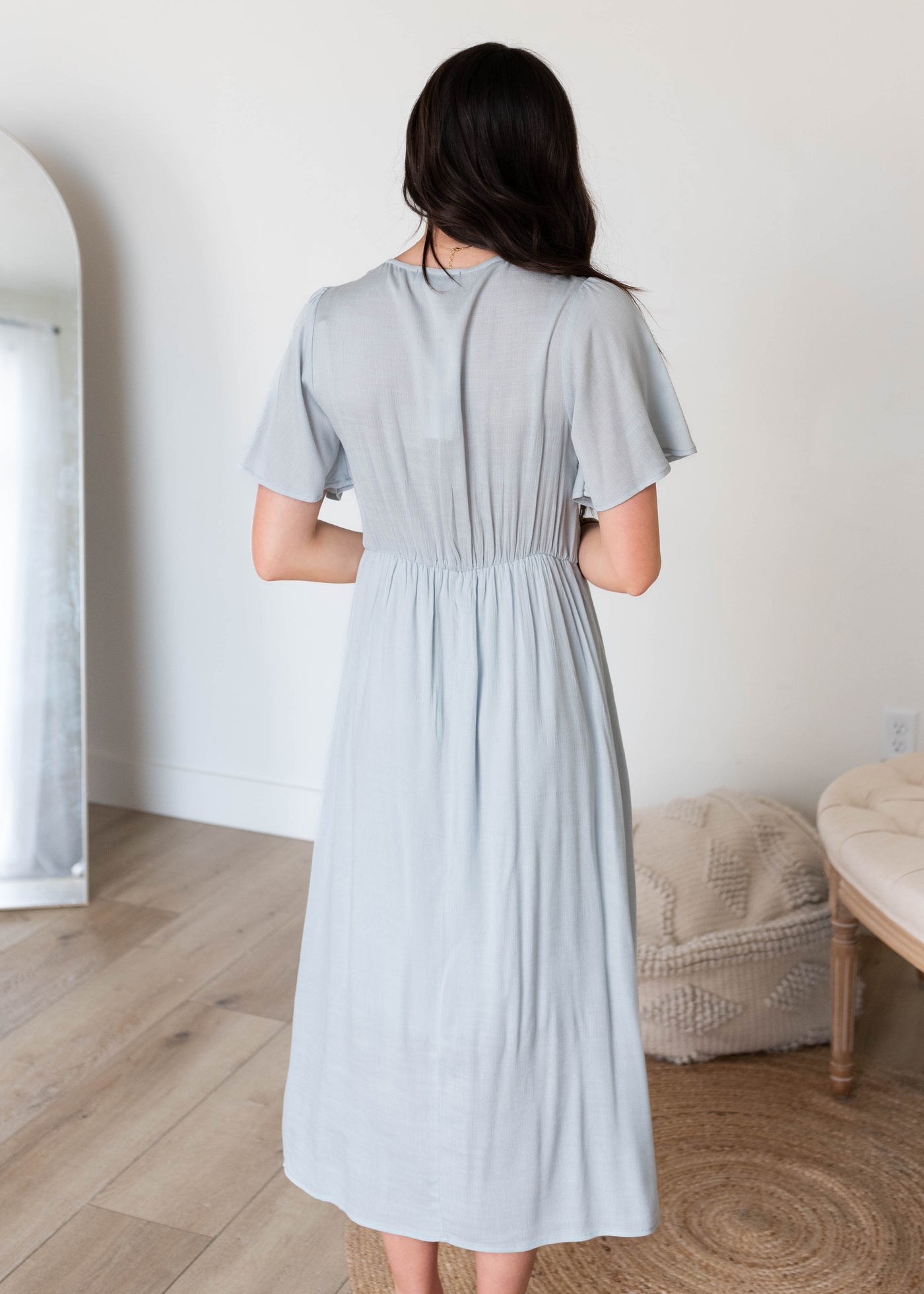 Back view of the dusty blue wrap dress