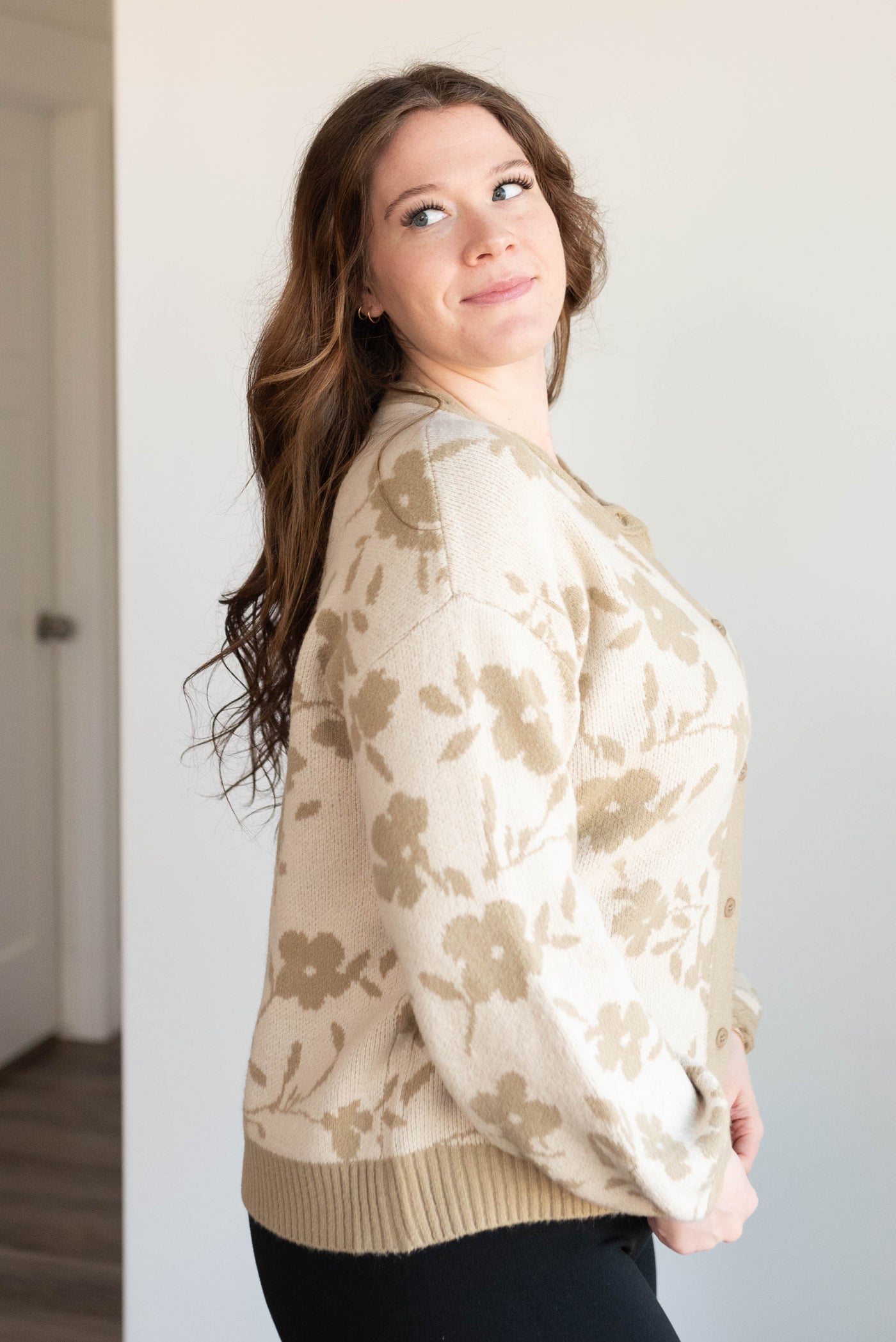 Side view of the plus size taupe floral cardigan