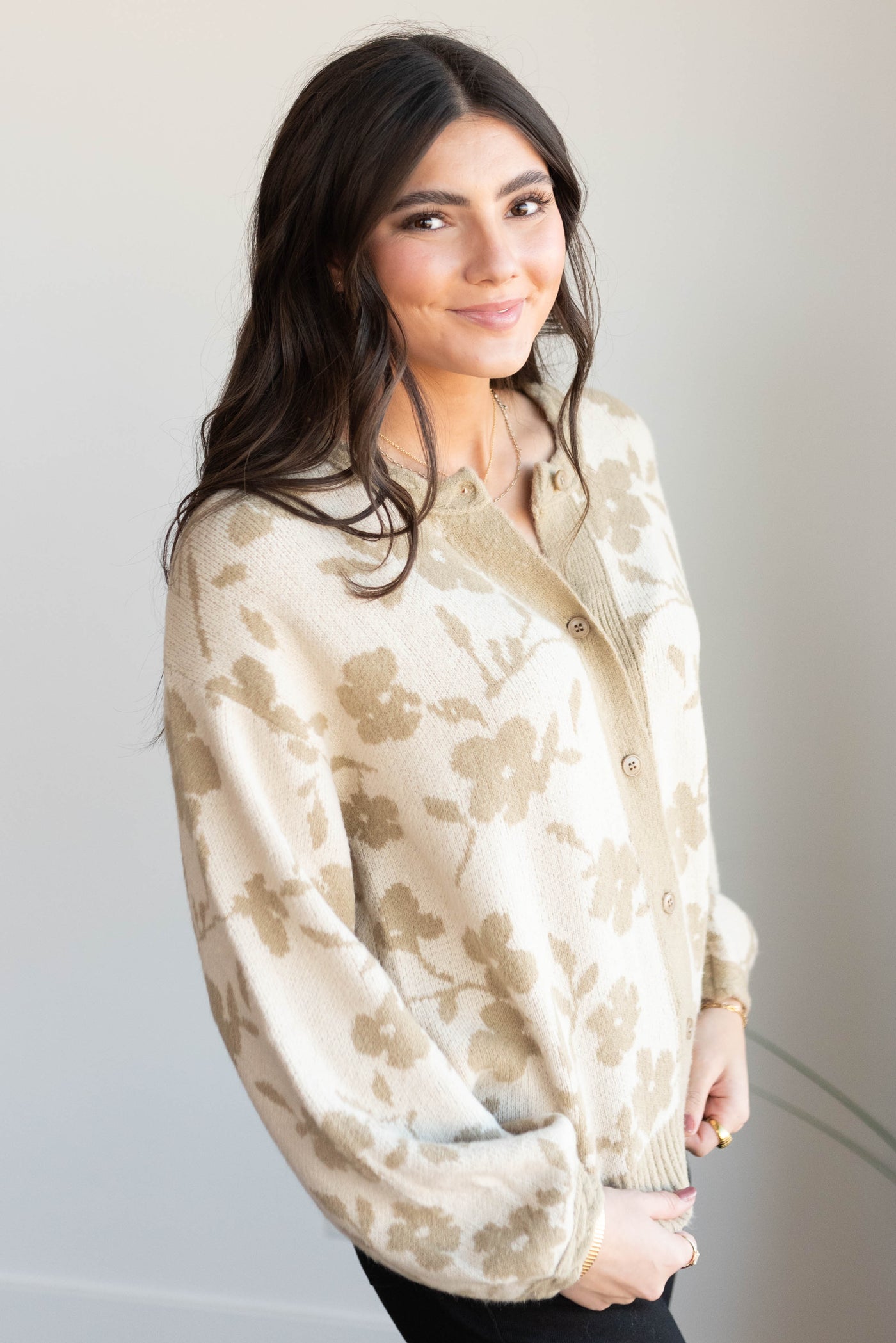 Side view of the taupe floral cardigan