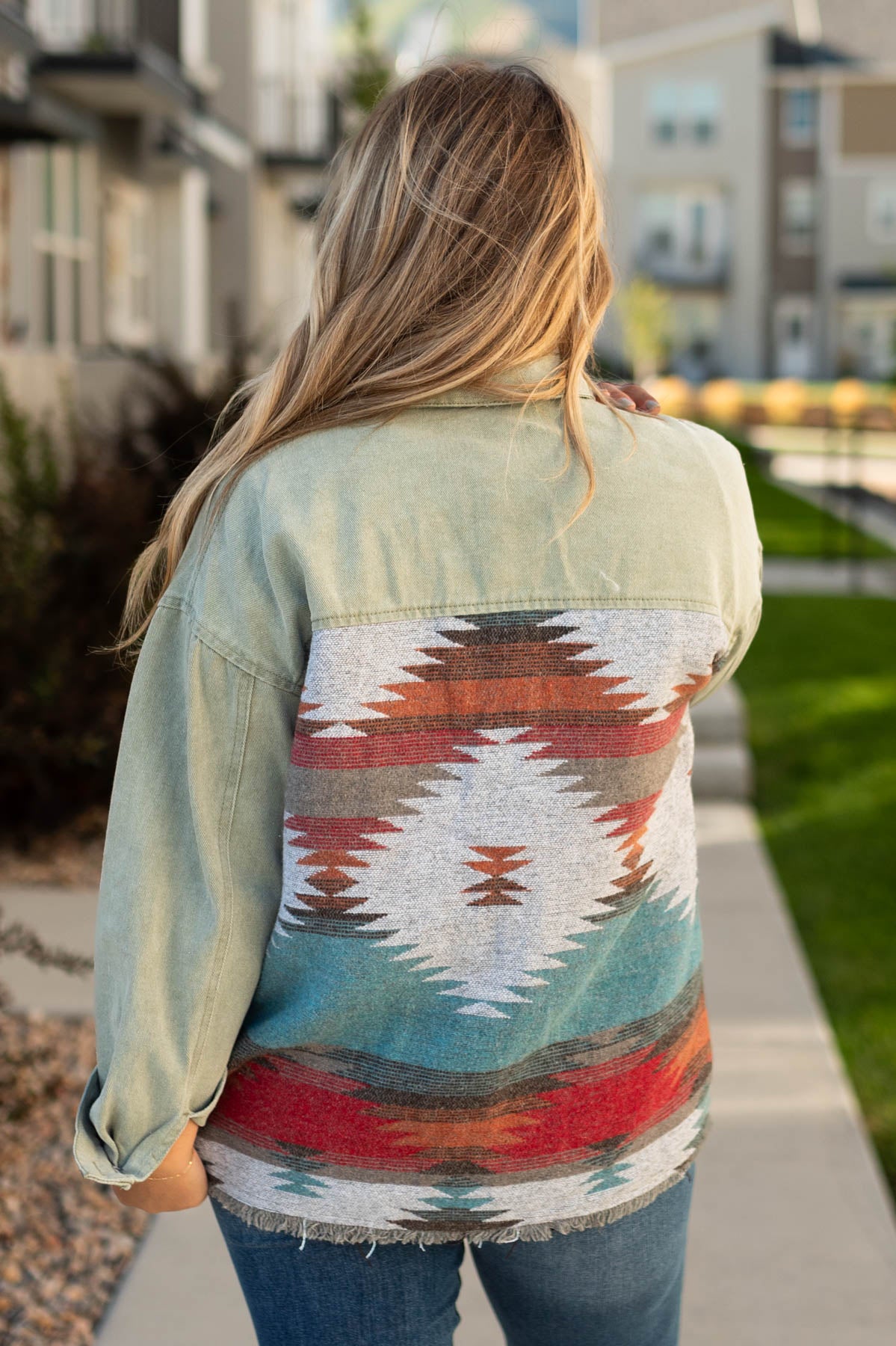 Back view of a olive denim jacket