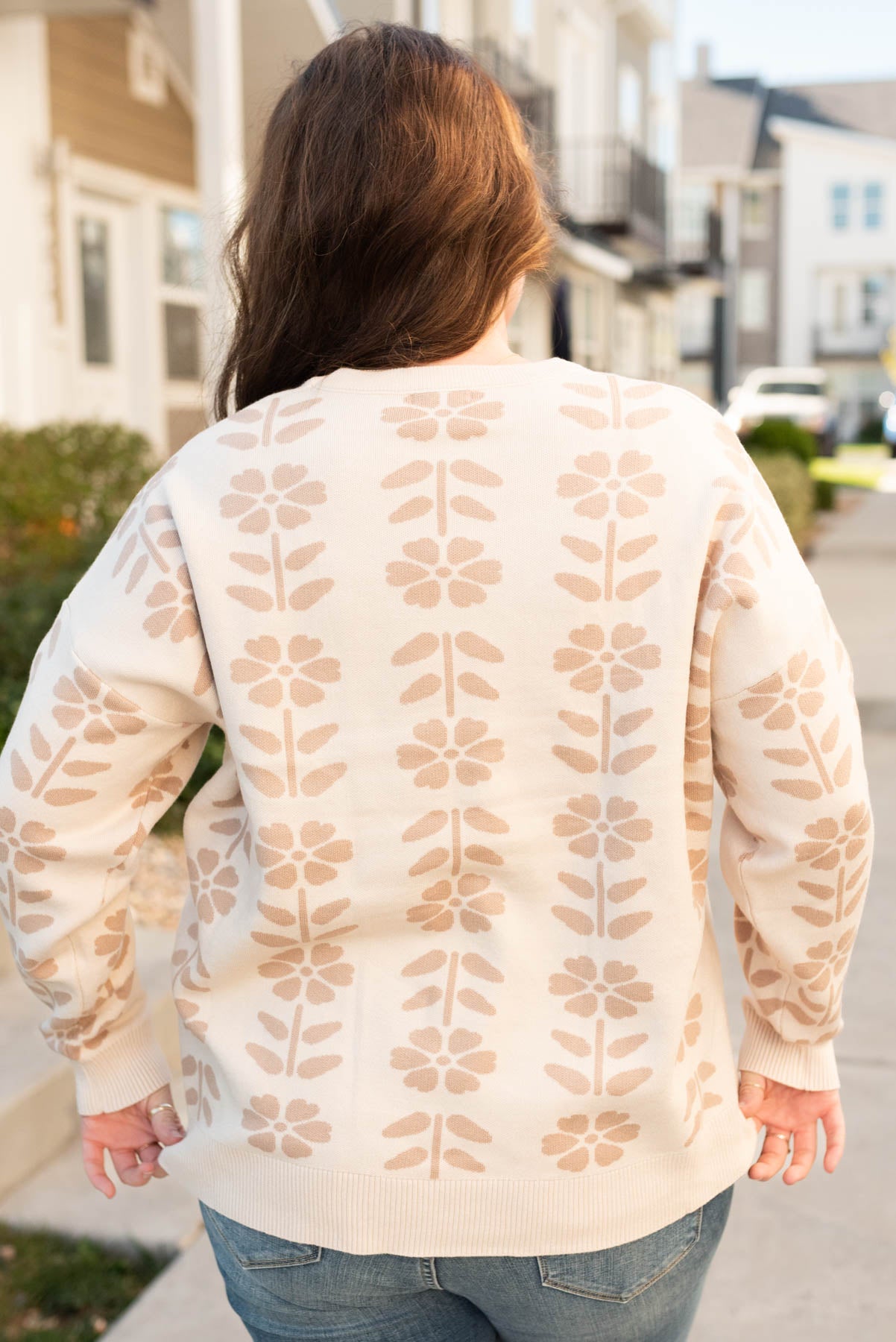 Back view of the oatmeal floral sweater