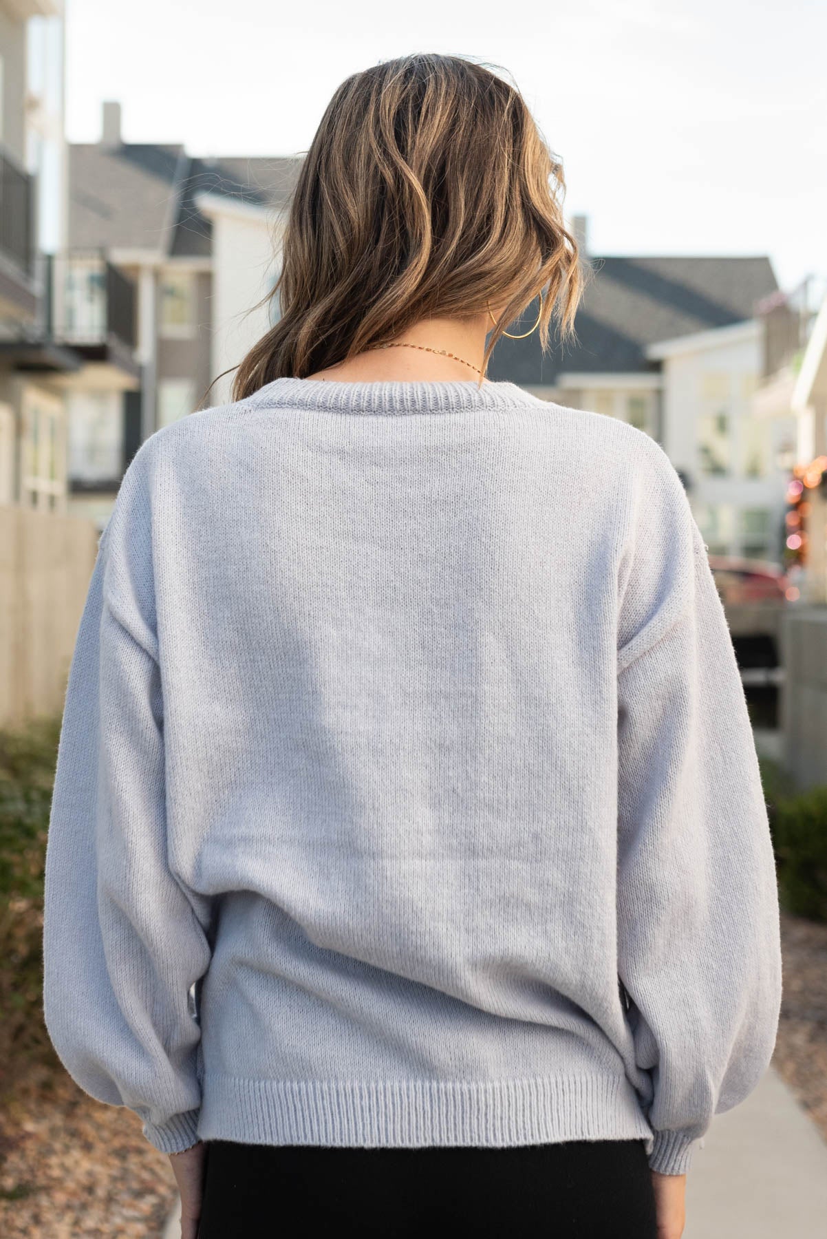 Back view of the stay spooky light grey sweater