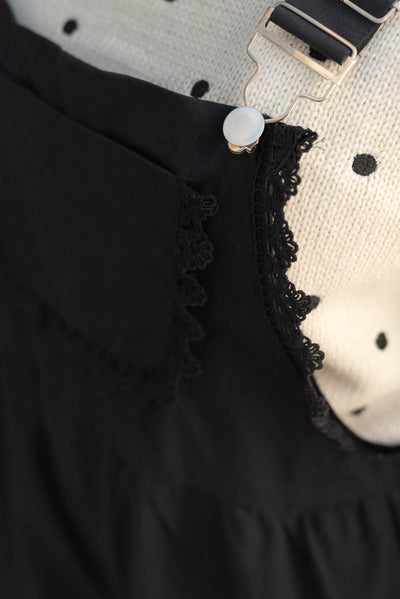 Close up of the lace on the black lace shortalls