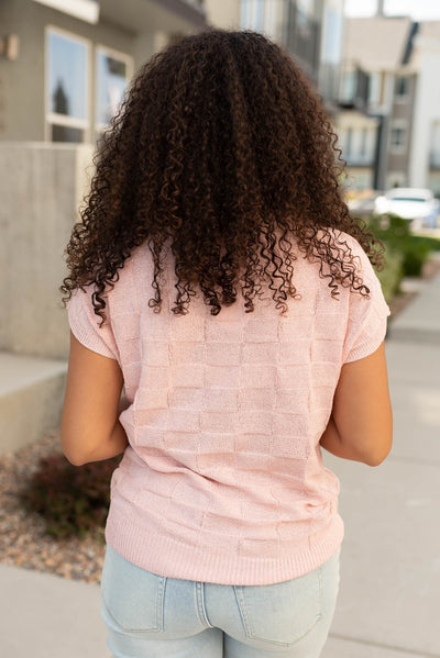 Back view of the dusty pink sweater vest