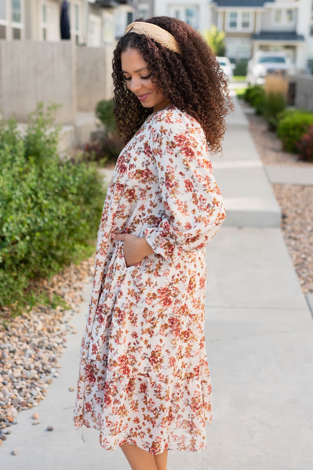 Side view of the cream flroal tiered dress