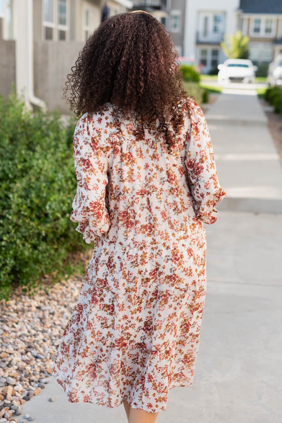 Back view of the cream floral tiered dress