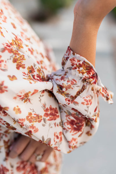 Close up of the sleeve on the cream floral tiered dress