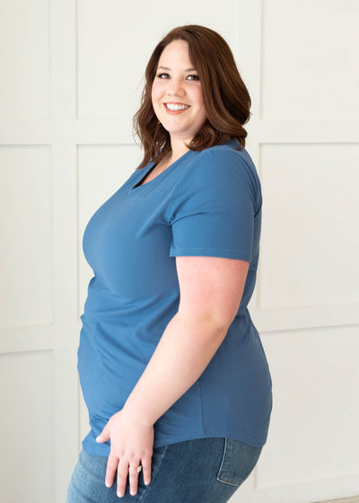 Side view of the classic blue v-neck top in plus size