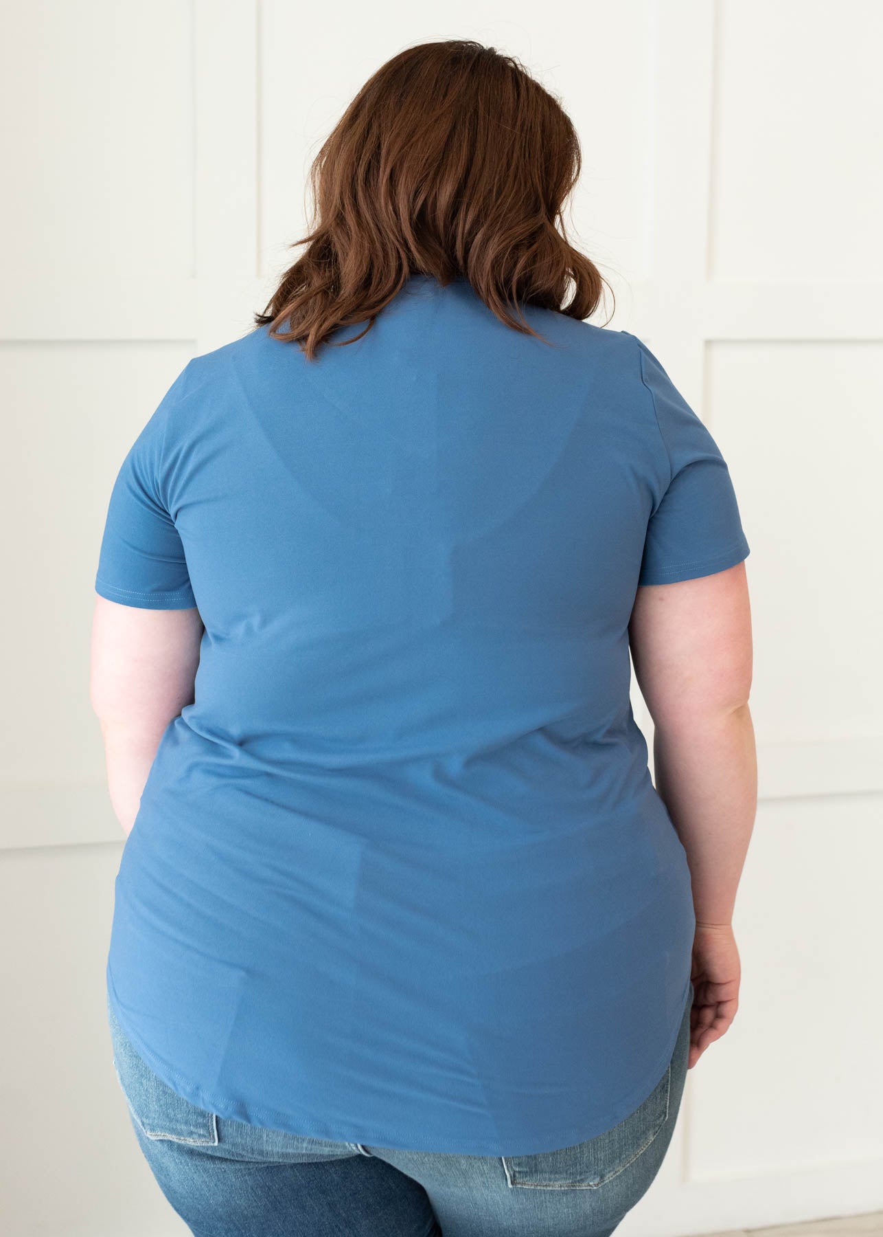 Back view of the plus size classic blue v-neck top