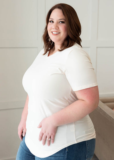 Side view of the plus size classic cream v-neck