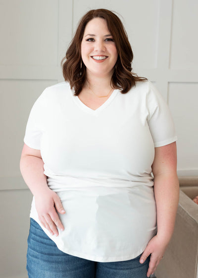 Front view of the plus size classic white v-neck top