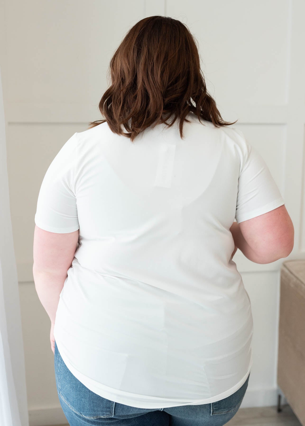 Back view of the plus size classic white v-neck top