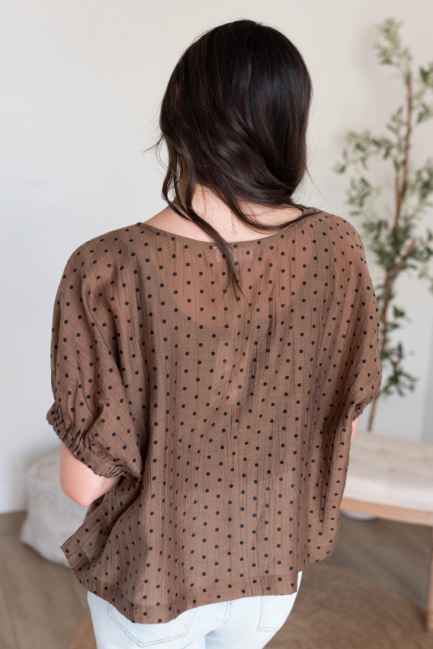 Back view of the chocolate polka dot top