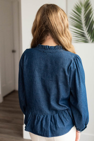 Back view of the dark denim bow top