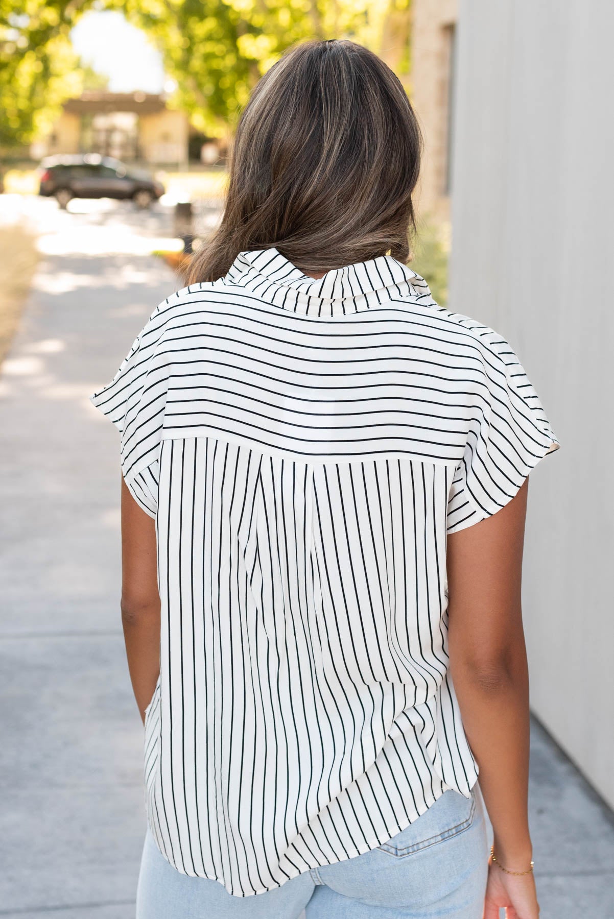 Back view of the white black stripe top