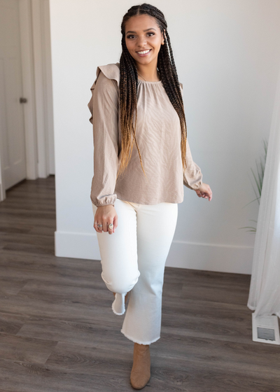 Beige long sleeve top with ruffle on the shoulder