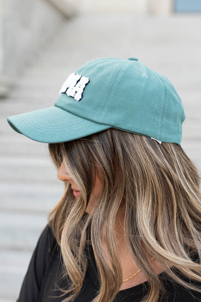 Side view of the dark teal Sherpa Mama hat