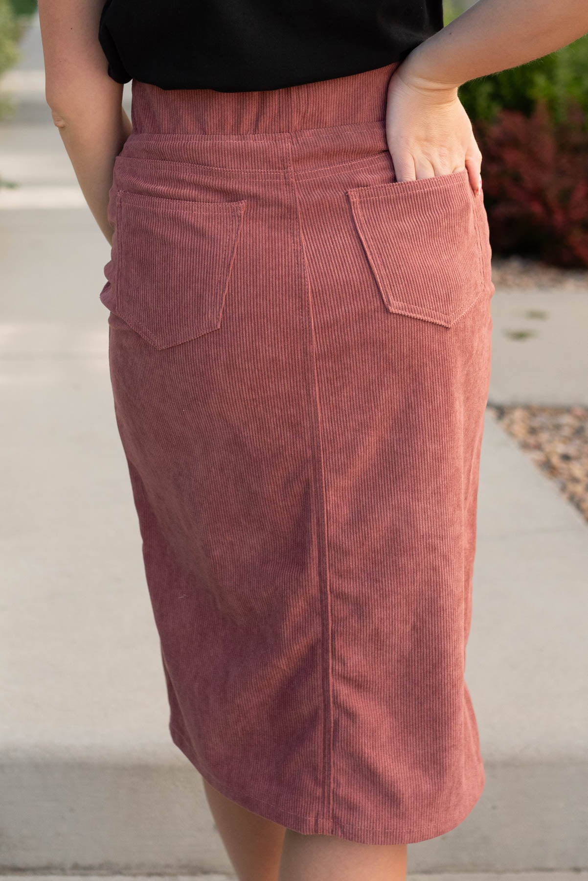 Back view of the dusty rose corduroy skirt