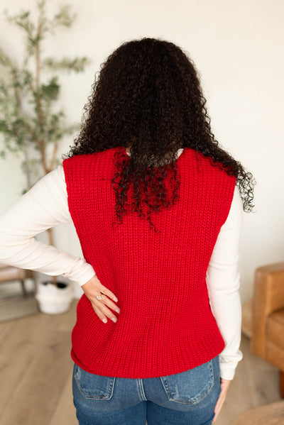 Back view of the red knit sweater vest