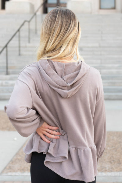 Back view of the mocha ruffle pullover with a hoodie