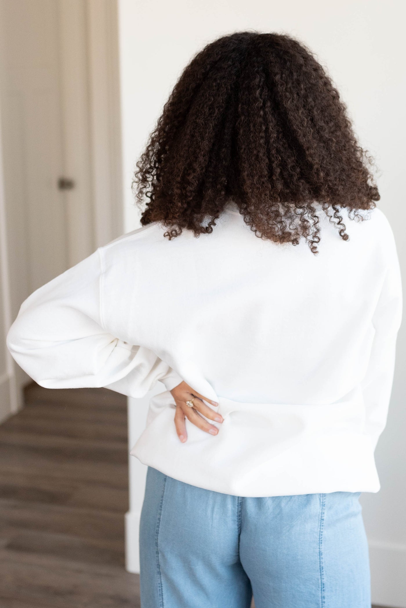 Back view of the white bows graphic sweatshirt