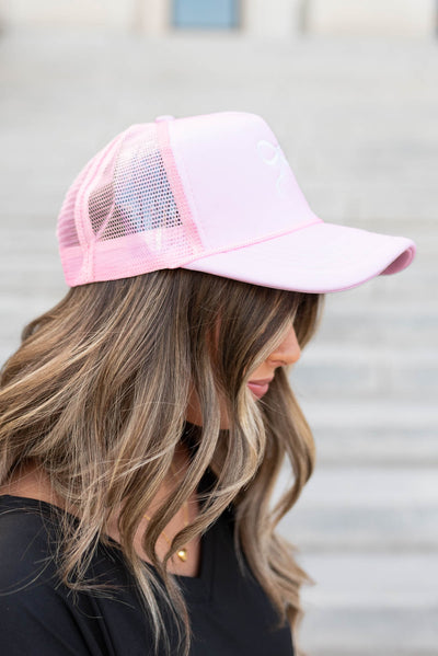 Side view of the pink embroidered bow hat