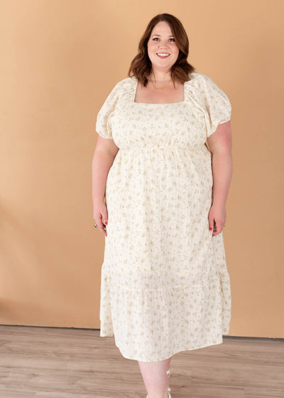 Short sleeve tan floral dress with a square neck in plus size