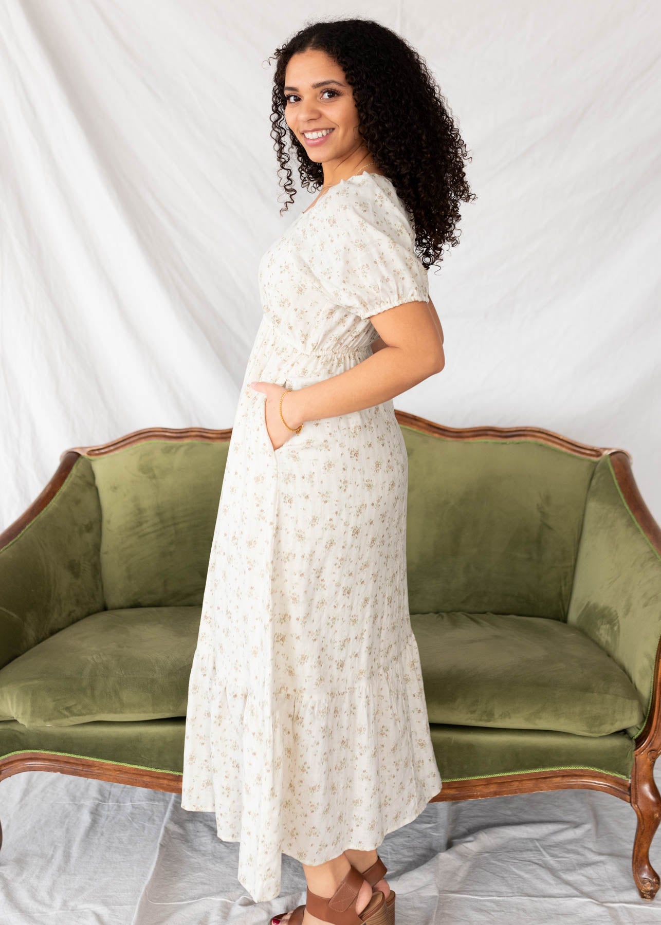 Side view of the tan floral dress with pockets