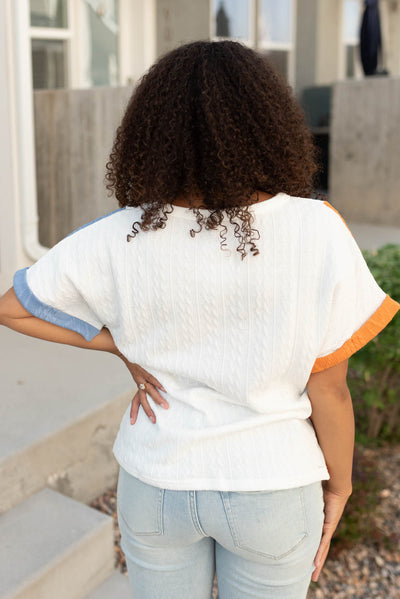 Back view of the blue orange color block top