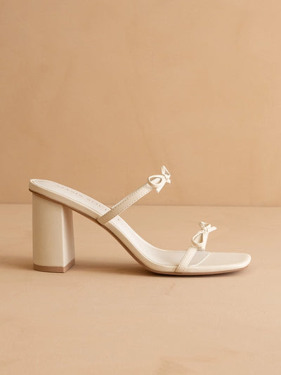 Cream double strap bow heels