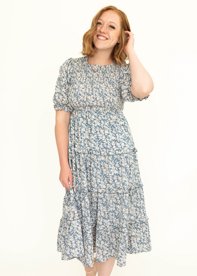 Short sleeve blue floral tiered dress.